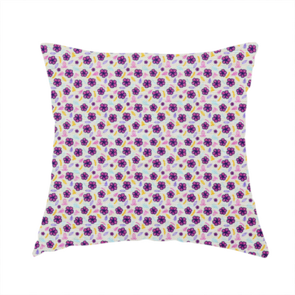The fabric used to create this handmade cushion is a dense, small-scale ditsy floral print. The pattern is composed of miniature five-petal magenta flowers outlined in dark purple, scattered symmetrically alongside tiny pastel pink blossoms, lavender leaves, and small ochre yellow botanical accents across a light, textured off-white background.