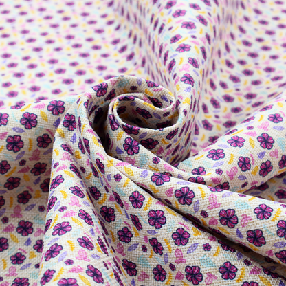 A dense, small-scale ditsy floral print. The pattern is composed of miniature five-petal magenta flowers outlined in dark purple, scattered symmetrically alongside tiny pastel pink blossoms, lavender leaves, and small ochre yellow botanical accents across a light, textured off-white background.