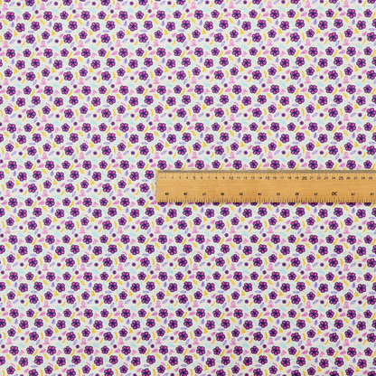 A dense, small-scale ditsy floral print. The pattern is composed of miniature five-petal magenta flowers outlined in dark purple, scattered symmetrically alongside tiny pastel pink blossoms, lavender leaves, and small ochre yellow botanical accents across a light, textured off-white background.