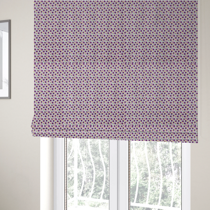 The fabric used to create these Roman blinds is a dense, small-scale ditsy floral print. The pattern is composed of miniature five-petal magenta flowers outlined in dark purple, scattered symmetrically alongside tiny pastel pink blossoms, lavender leaves, and small ochre yellow botanical accents across a light, textured off-white background.