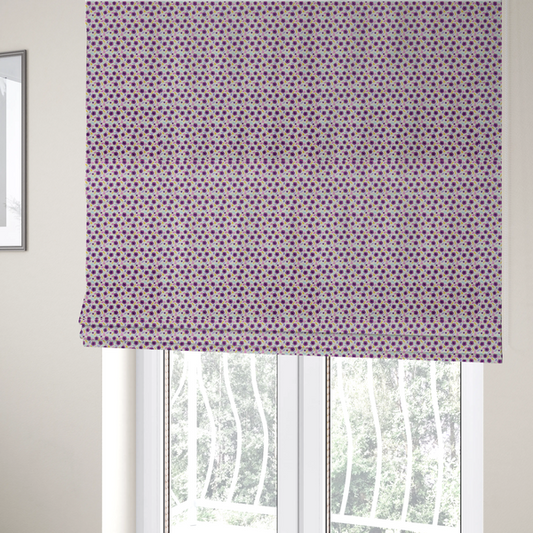 The fabric used to create these Roman blinds is a dense, small-scale ditsy floral print. The pattern is composed of miniature five-petal magenta flowers outlined in dark purple, scattered symmetrically alongside tiny pastel pink blossoms, lavender leaves, and small ochre yellow botanical accents across a light, textured off-white background.