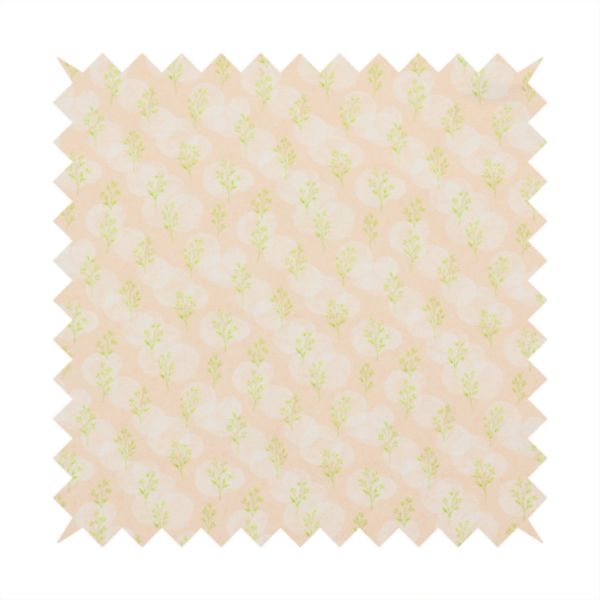 A soft watercolour design. The background consists of a subtle pastel peach wash layered with faint, painterly off-white circular polka dots. Arranged in neat diagonal rows over the circles are miniature, light lime green botanical sprigs and fine leaf stems.