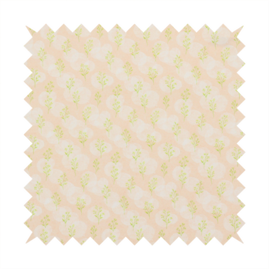 A soft watercolour design. The background consists of a subtle pastel peach wash layered with faint, painterly off-white circular polka dots. Arranged in neat diagonal rows over the circles are miniature, light lime green botanical sprigs and fine leaf stems.
