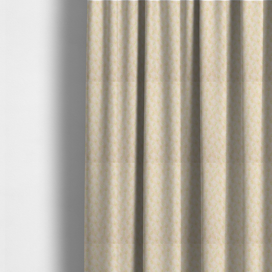 The fabric used to create these made-to-measure curtains is a soft watercolour design. The background consists of a subtle pastel peach wash layered with faint, painterly off-white circular polka dots. Arranged in neat diagonal rows over the circles are miniature, light lime green botanical sprigs and fine leaf stems.
