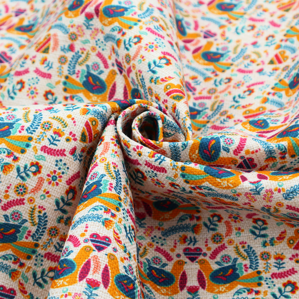 A Scandinavian folk art pattern. The design features symmetrical pairs of stylized teal and golden-yellow lovebirds facing each other under a small striped heart. They are surrounded by an intricate all-over arrangement of tiny multi-coloured wildflowers, hearts, and vines in shades of orange, magenta, yellow, and blue over a textured, off-white background.