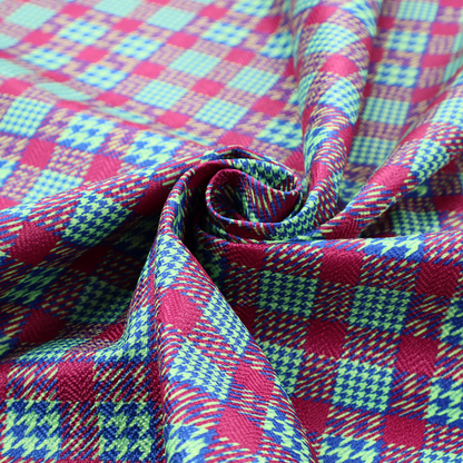 A dense, multi-coloured hounds tooth plaid pattern. The design features alternating blocks of bright magenta pink, electric royal blue, and neon lime green, interwoven into a structured, repetitive grid check with a classic textured twill appearance.