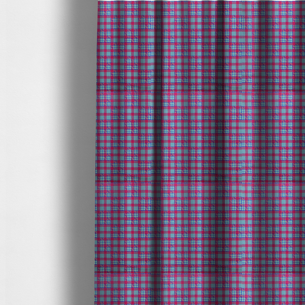 The fabric used to create these made-to-measure curtains is a dense, multi-coloured hounds tooth plaid pattern. The design features alternating blocks of bright magenta pink, electric royal blue, and neon lime green, interwoven into a structured, repetitive grid check with a classic textured twill appearance.