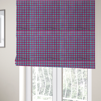 The fabric used to create these Roman blinds is a dense, multi-coloured hounds tooth plaid pattern. The design features alternating blocks of bright magenta pink, electric royal blue, and neon lime green, interwoven into a structured, repetitive grid check with a classic textured twill appearance.