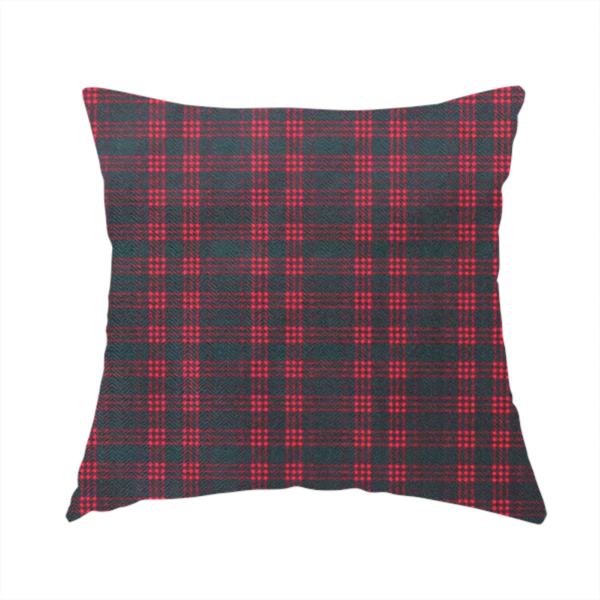 The fabric used to create this handmade cushion is a classic, moody plaid pattern. The design is woven onto a dark charcoal grey background with a subtle, textured herringbone pattern, overlaid with a structured grid of thin, repeating intersecting lines in a bright, contrasting crimson red.