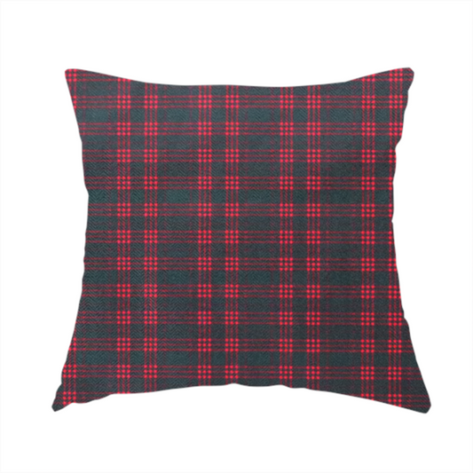 The fabric used to create this handmade cushion is a classic, moody plaid pattern. The design is woven onto a dark charcoal grey background with a subtle, textured herringbone pattern, overlaid with a structured grid of thin, repeating intersecting lines in a bright, contrasting crimson red.