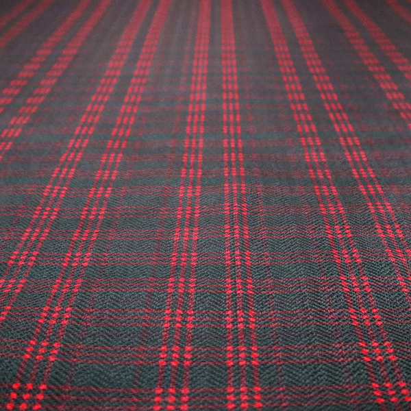 A classic, moody plaid pattern. The design is woven onto a dark charcoal grey background with a subtle, textured herringbone pattern, overlaid with a structured grid of thin, repeating intersecting lines in a bright, contrasting crimson red.