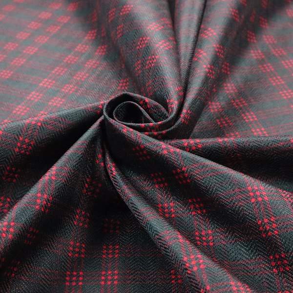 A classic, moody plaid pattern. The design is woven onto a dark charcoal grey background with a subtle, textured herringbone pattern, overlaid with a structured grid of thin, repeating intersecting lines in a bright, contrasting crimson red.