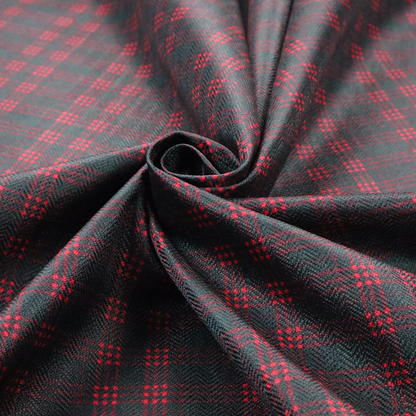 A classic, moody plaid pattern. The design is woven onto a dark charcoal grey background with a subtle, textured herringbone pattern, overlaid with a structured grid of thin, repeating intersecting lines in a bright, contrasting crimson red.