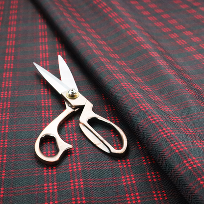 A classic, moody plaid pattern. The design is woven onto a dark charcoal grey background with a subtle, textured herringbone pattern, overlaid with a structured grid of thin, repeating intersecting lines in a bright, contrasting crimson red.