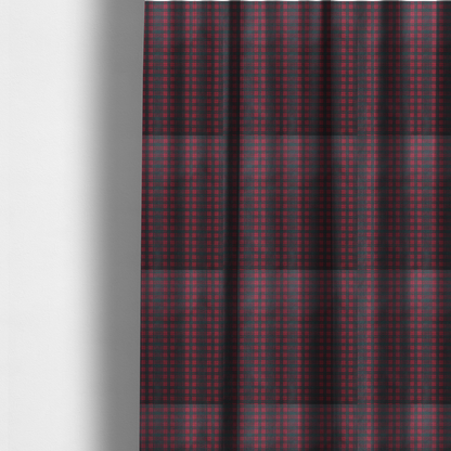 The fabric used to create these made-to-measure curtains is a classic, moody plaid pattern. The design is woven onto a dark charcoal grey background with a subtle, textured herringbone pattern, overlaid with a structured grid of thin, repeating intersecting lines in a bright, contrasting crimson red.