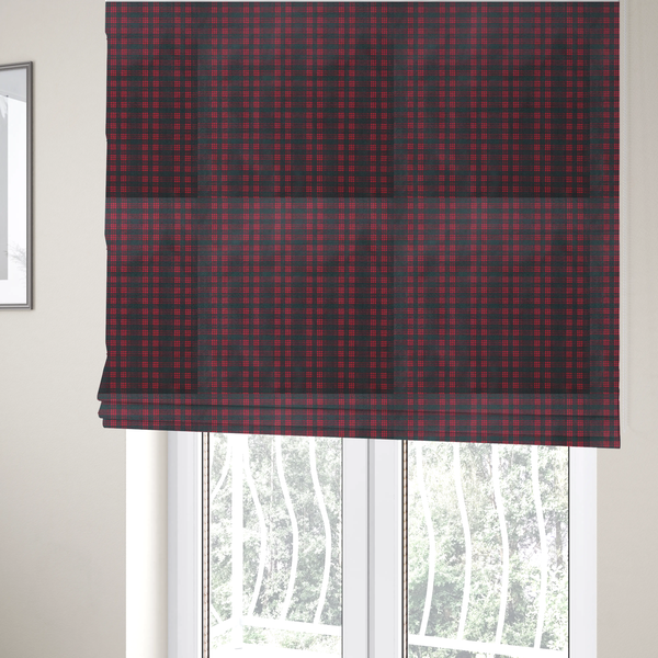 The fabric used to create these Roman blinds is a classic, moody plaid pattern. The design is woven onto a dark charcoal grey background with a subtle, textured herringbone pattern, overlaid with a structured grid of thin, repeating intersecting lines in a bright, contrasting crimson red.
