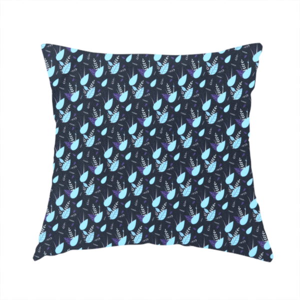 The fabric used to create this handmade cushion is a dense, miniature botanical print. The design features small, light ice-blue teardrop shapes resembling abstract petals or water droplets, paired with tiny light blue textured leaves and white sprigs. The pattern is scattered over a dark charcoal grey background that features a subtle, woven herringbone texture.