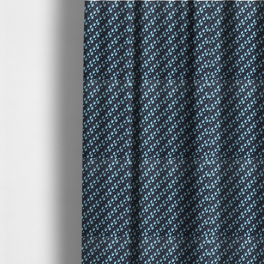 The fabric used to create these made-to-measure curtains is a dense, miniature botanical print. The design features small, light ice-blue teardrop shapes resembling abstract petals or water droplets, paired with tiny light blue textured leaves and white sprigs. The pattern is scattered over a dark charcoal grey background that features a subtle, woven herringbone texture.