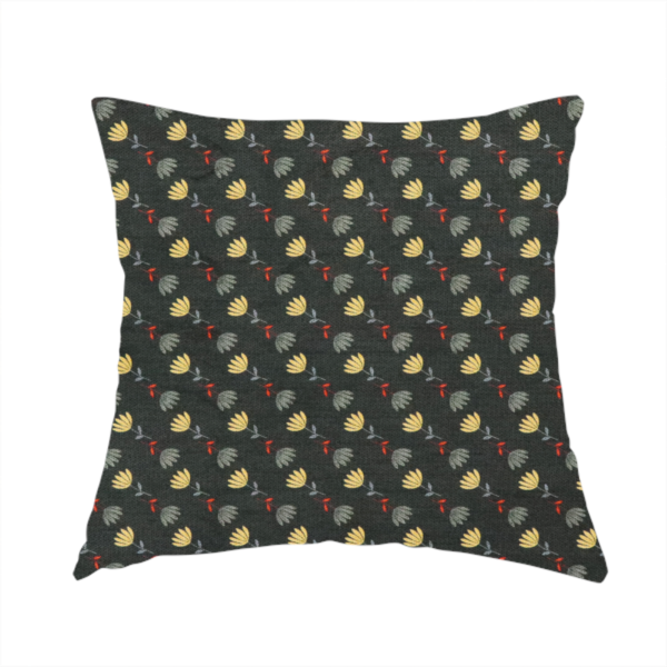 The fabric used to create this handmade cushion is a neat, small-scale botanical pattern arranged in diagonal rows. The design showcases small, stylized fan-shaped flowers in a muted golden-yellow, interspersed with grey dandelions and tiny red leaves on thin stems.