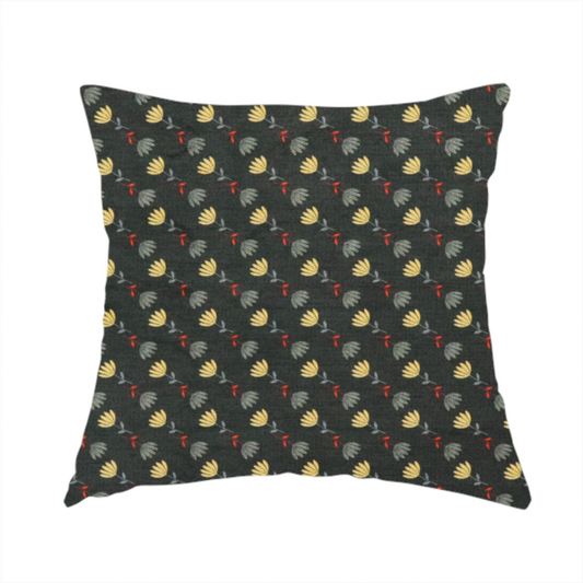 The fabric used to create this handmade cushion is a neat, small-scale botanical pattern arranged in diagonal rows. The design showcases small, stylized fan-shaped flowers in a muted golden-yellow, interspersed with grey dandelions and tiny red leaves on thin stems.
