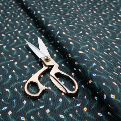 A dense, elegant peacock feather motif. The design showcase a repetitive pattern of small, curved green peacock feathers with bright orange, blue, and white "eyes" floating diagonally. The pattern is set against a dark charcoal grey background that has a subtle, woven herringbone texture.