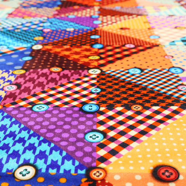 A vibrant, multi-coloured faux patchwork fabric pattern composed of alternating right-angled triangles to form a geometric grid. Each triangular patch features a distinct retro design, including hound's-tooth, gingham checks, diagonal plaids, and polka dots in various scales.