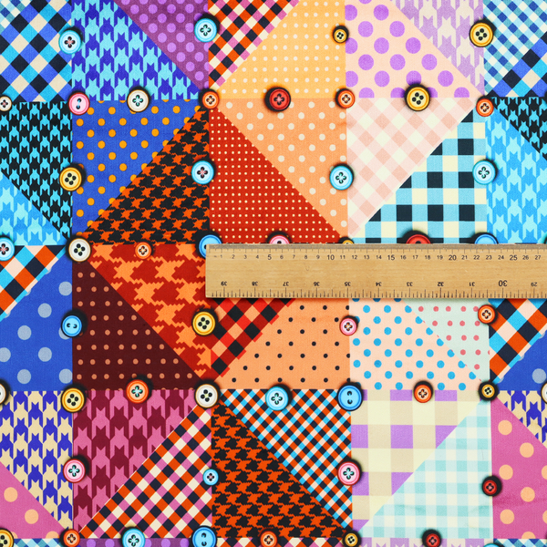 A vibrant, multi-coloured faux patchwork fabric pattern composed of alternating right-angled triangles to form a geometric grid. Each triangular patch features a distinct retro design, including hound's-tooth, gingham checks, diagonal plaids, and polka dots in various scales.