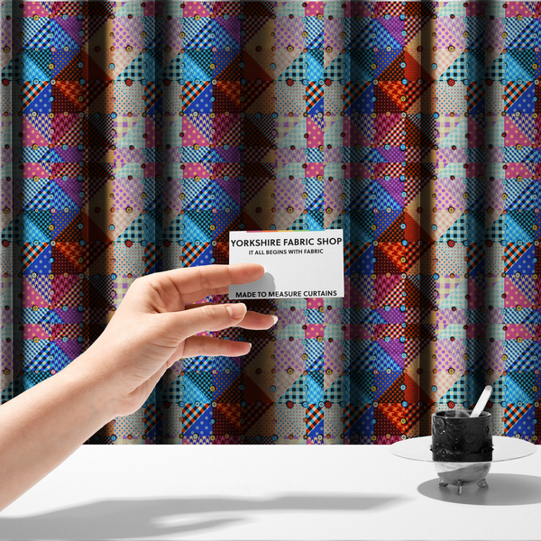 The fabric used to create these made-to-measure curtains is a vibrant, multi-coloured faux patchwork fabric pattern composed of alternating right-angled triangles to form a geometric grid. Each triangular patch features a distinct retro design, including hound's-tooth, gingham checks, diagonal plaids, and polka dots in various scales.