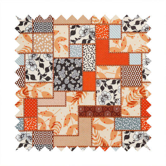 A patchwork fabric pattern featuring a mix of rectangular blocks with floral prints, polka dots, autumn leaves, and geometric shapes in orange, beige, brown, and black-and-white.