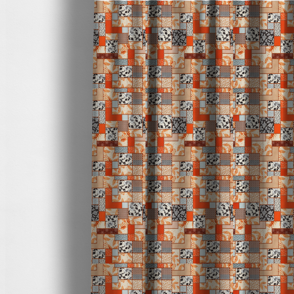 The fabric used to create these made-to-measure curtains is a patchwork fabric pattern featuring a mix of rectangular blocks with floral prints, polka dots, autumn leaves, and geometric shapes in orange, beige, brown, and black-and-white.