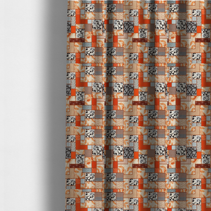 The fabric used to create these made-to-measure curtains is a patchwork fabric pattern featuring a mix of rectangular blocks with floral prints, polka dots, autumn leaves, and geometric shapes in orange, beige, brown, and black-and-white.