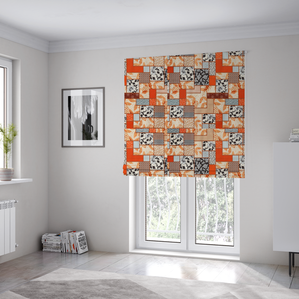 The fabric used to create these Roman blinds is a patchwork fabric pattern featuring a mix of rectangular blocks with floral prints, polka dots, autumn leaves, and geometric shapes in orange, beige, brown, and black-and-white.
