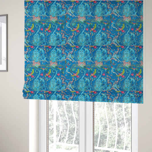 The fabric used to create these Roman blinds is a vibrant turquoise blue fabric featuring an intricate, symmetrical maximalist print of a mythical tropical rainforest. Large, ethereal blue tigers with pink accents are flanked by dense fronds. The repeating pattern is filled with exotic jungle wildlife, including leopards, sloths hanging from vines, winged monkeys, bats, and colourful macaws in shades of bright pink and lime green.