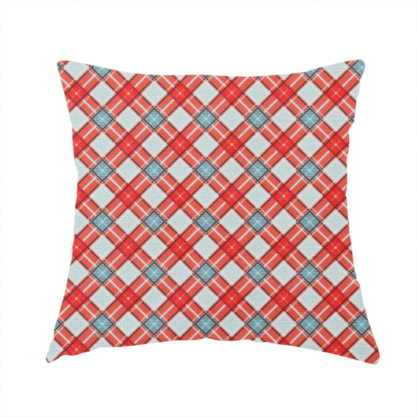 The fabric used to create this handmade cushion is a vibrant diagonal plaid fabric pattern featuring crossing red, light blue, and white stripes on a textured background.