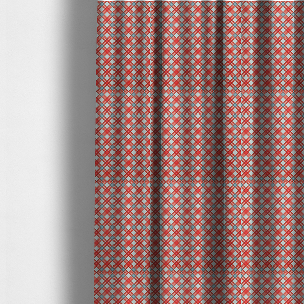 The fabric used to create these made-to-measure curtains is a vibrant diagonal plaid fabric pattern featuring crossing red, light blue, and white stripes on a textured background.