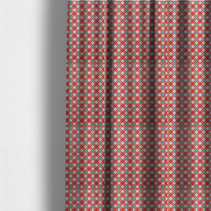 The fabric used to create these made-to-measure curtains is a vibrant diagonal plaid fabric pattern featuring crossing red, light blue, and white stripes on a textured background.
