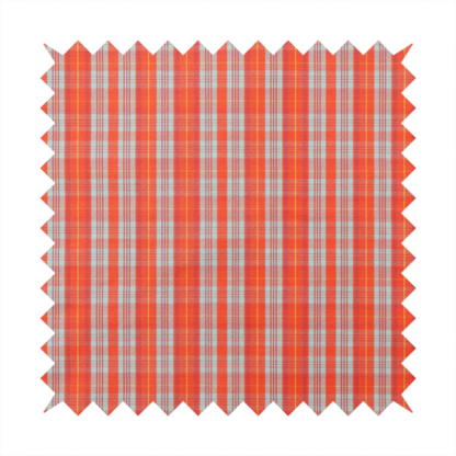 A bright plaid fabric pattern featuring thin, intersecting stripes of orange, light teal, and yellow on a textured background.