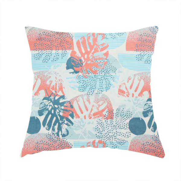 The fabric used to create this handmade cushion is an abstract tropical fabric pattern featuring monstera leaf silhouettes and mid-century geometric shapes in coral, teal, aqua, and cream.