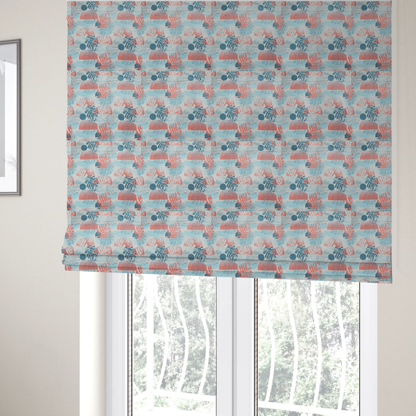 The fabric used to create these Roman blinds is an abstract tropical fabric pattern featuring monstera leaf silhouettes and mid-century geometric shapes in coral, teal, aqua, and cream.
