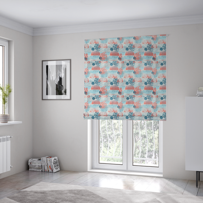The fabric used to create these Roman blinds is an abstract tropical fabric pattern featuring monstera leaf silhouettes and mid-century geometric shapes in coral, teal, aqua, and cream.