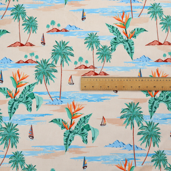 Vintage-style Hawaiian scenic fabric featuring palm trees, small sailboats, and orange Bird of Paradise flowers on a sandy beige background.