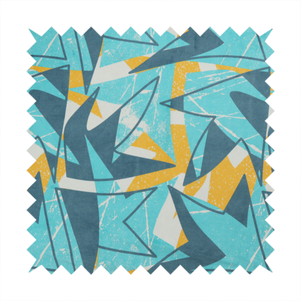 Fabric featuring a bold, retro geometric pattern with abstract, sharp arrow and shard shapes in turquoise, slate blue, mustard yellow, and white with a distressed texture.