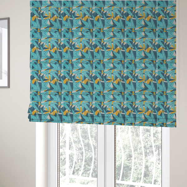 The fabric used to create these Roman blinds is a bold, retro geometric pattern with abstract, sharp arrow and shard shapes in turquoise, slate blue, mustard yellow, and white with a distressed texture.
