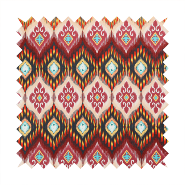 A vibrant, ornate ikat fabric pattern featuring rows of decorative diamond emblems, flame-like borders, and intricate scrollwork motifs in red, black, beige, and turquoise.