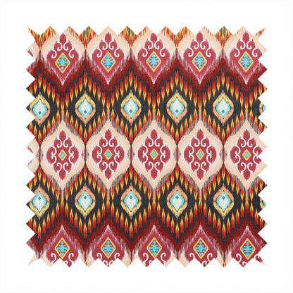 A vibrant, ornate ikat fabric pattern featuring rows of decorative diamond emblems, flame-like borders, and intricate scrollwork motifs in red, black, beige, and turquoise.