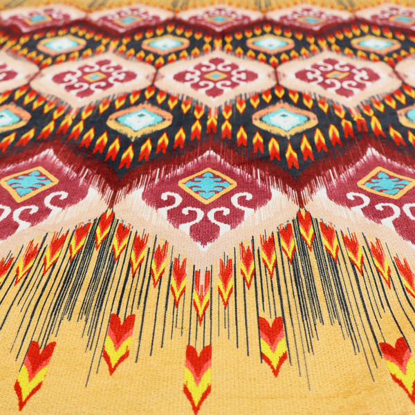 A vibrant, ornate ikat fabric pattern featuring rows of decorative diamond emblems, flame-like borders, and intricate scrollwork motifs in red, black, beige, and turquoise.