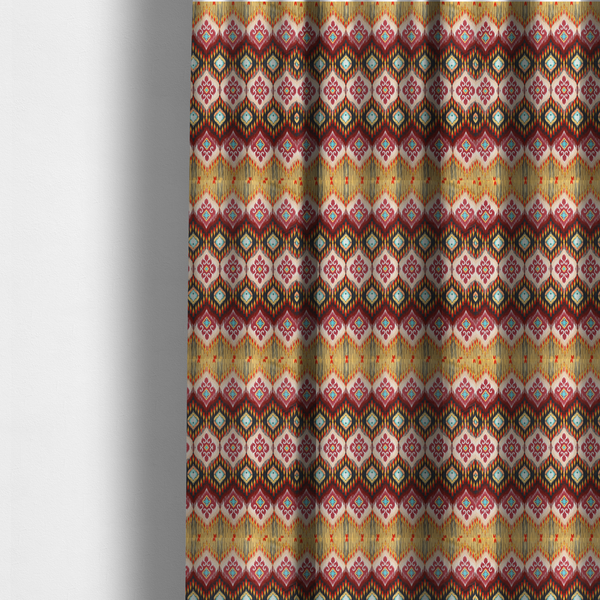 The fabric used to create these made-to-measure curtains is a vibrant, ornate ikat fabric pattern featuring rows of decorative diamond emblems, flame-like borders, and intricate scrollwork motifs in red, black, beige, and turquoise.
