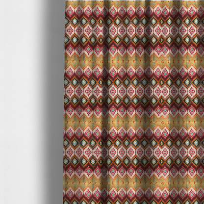 The fabric used to create these made-to-measure curtains is a vibrant, ornate ikat fabric pattern featuring rows of decorative diamond emblems, flame-like borders, and intricate scrollwork motifs in red, black, beige, and turquoise.