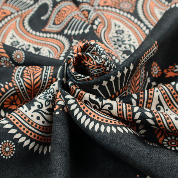 A black fabric pattern featuring elegant horizontal bands of intricate paisley motifs and ornate cross-shaped designs in cream and terracotta orange.