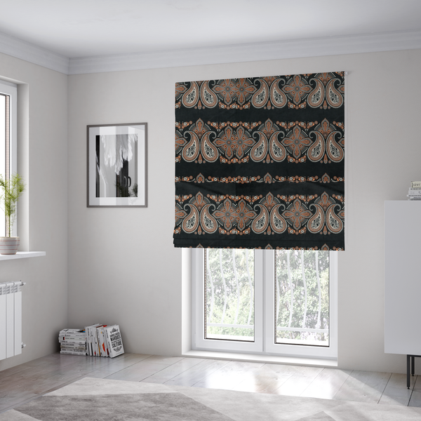 The fabric used to create these Roman blinds is a black fabric pattern featuring elegant horizontal bands of intricate paisley motifs and ornate cross-shaped designs in cream and terracotta orange.